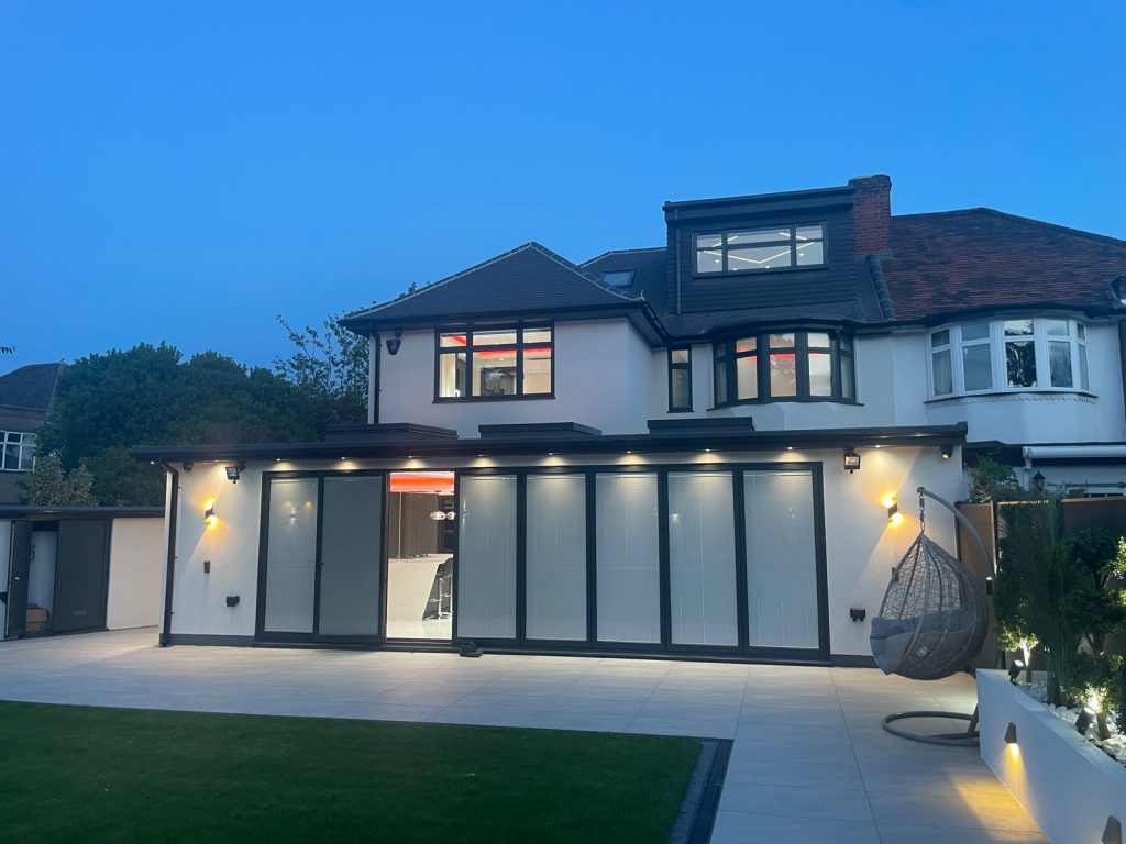 Detached family home, evening light - VED Construction